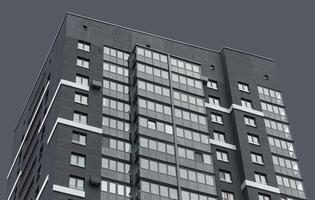 Building with modern architecture. High rise residential tower with geometric concrete facade, photo