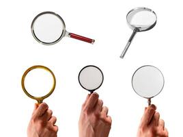 Hand holding magnifying glass with lens zooming and enlarging view. Concept of investigation, photo