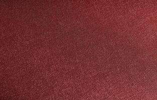 Minimalistic designer paper closeup. Monochrome red and marsala background with glossy metallic photo