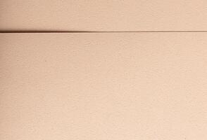 Minimalistic designer paper closeup. Monochrome beige and cream sheets with geometric overlap, photo