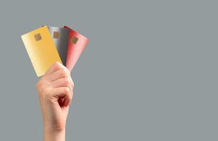 holding a bank card for secure payment at a retail store. Multiple options for transaction, photo
