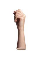 Curled fingers in gentle fist holding thin invisible card. Soft natural skin and relaxed wrist show photo