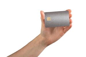 Bank card in hand, with debit or credit card and chip for secure payment. Financial service, online photo
