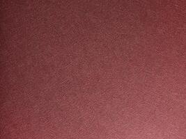 Chic designer paper background. Fashionable red and marsala surface with metallic gloss, smooth photo