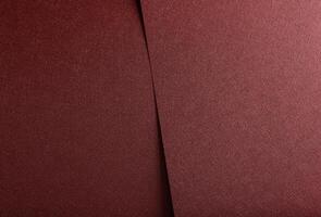 Monochrome designer paper background. Red and marsala metallic sheets with glossy gradient, photo