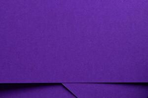 Elegant designer paper in bright and dark violet purple tones with matte texture and monochrome photo