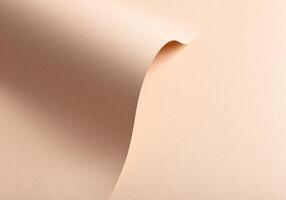 Monochrome background with wavy beige and cream designer paper. Curved folds and perforated shapes, photo