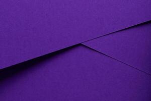Premium designer paper in violet and purple tones with matte surface and elegant texture. photo