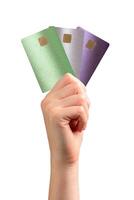 Woman holding a bank card, using an ATM for payment, representing security, finance, and digital photo