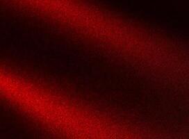 Elegant background with red gradient and sandy grain texture. Burgundy surface with shimmer glow, photo