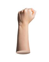 Fist clenched hand raised in activism and protest gesture. Female body part showing resistance, photo
