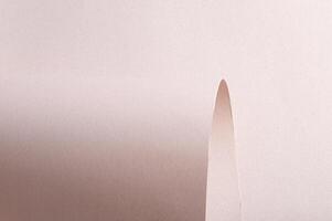 Elegant pastel designer paper with a matte, monochrome texture and geometric folds. The minimalistic photo