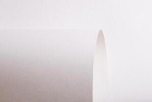 Premium monochrome paper texture with a minimalistic design and elegant folds. The pastel, matte photo