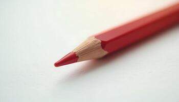 Close up of a sharpened red colored pencil tip on white surface detailed view Generated using AI photo