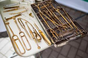 A table with various gold tools on it photo