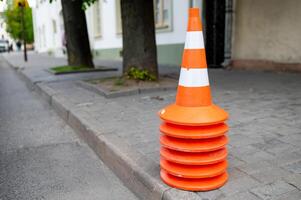 A traffic cone on the side of the road photo