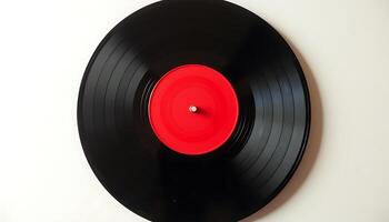 Black vinyl record with red center on white background close up photo Described by using AI