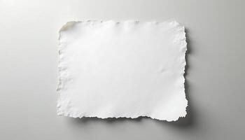 A single sheet of torn white paper on a light surface with shadows visible around edges Generated using AI photo