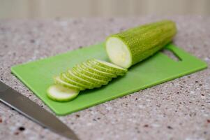 A green cutting board photo