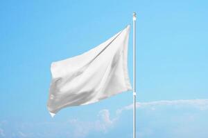 Empty white flag in the wind on clear blue sky, ideal for promotional design, customization or national identity mockups photo
