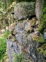 A person walking on a rocky cliff photo