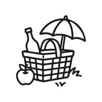 A simple, hand drawn line art doodle shows a picnic basket containing a wine bottle and umbrella. An apple sits beside the basket on the grass vector