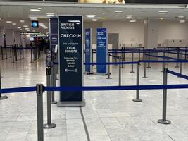 Nice, France - May 10, 2025 British Airways check-in area at airport featuring empty lines and signage, showcasing travel experience and modern design with copy space photo