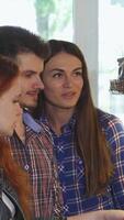 Friends joyfully exploring a bakery's tempting dessert showcase video