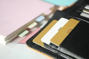 Wallet with cards and documents on a table photo