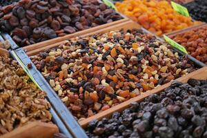 Vibrant dried fruits and nuts at a market stall photo