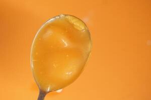 Ghee on a spoon top view photo
