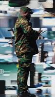 Vertical African american soldier works in command center with satellite data for surveillance, collecting intelligence for tactics and war planning in a national defense mission. Armed forces. Camera A. video