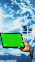 Vertical Modern black person in digital space uses isolated display with AI tools, representing artificial intelligence data structures and intelligent systems. Innovation and cybernetics for science. Camera B. video