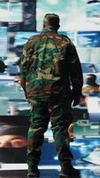 Vertical Armed forces officer monitoring satellite imagery to gather intelligence, collecting insight for war planning. African american man supporting mission control and global operations. Camera A. video