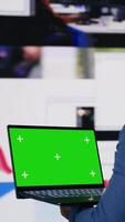 Vertical Black socials user shows a laptop with isolated screen, digital system of networks and applications on dashboard. Highlighting the integration of AI and fintech. Multitasking. Camera B. video
