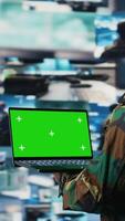 Vertical Black military personnel uses green screen on pc in command center, monitoring surveillance footage and enemy position intelligence for national safety. Tactical defense system. Camera A. video