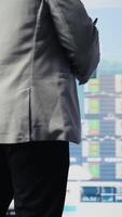 Vertical African american businessman contemplating about new powerful ideas to obtain funds, data insights for the financial and KPI projections decision making. Forecasting for productivity. Camera A. video