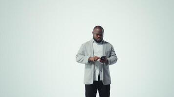 Happy person uses phone, interacting with social media posts on feed. Joyous man browsing social networks feed on smartphone in front of browser windows with short form content videos, camera A video