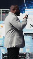 Vertical Business expert chat with people on phone call to examine big data insight, working on infographics monthly reports. Working on new growth strategy, forecasting development. Camera A. video