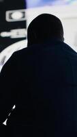 Vertical African American man symbolizing social anxiety due to information overload, suffering from an overwhelming impact of online content and mobile phone overuse. Mental health issues. Camera B. video
