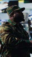 Vertical Officer monitoring real time combat data using advanced military systems, cyber tactics and digital surveillance to ensure battlefield control and strategic defense. War planning. Camera B. video