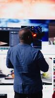 Vertical Black social media manager engaging with social network trends on screens, showcasing user interface and digital web platforms. Power of technology, influence and internet connection. Camera A. video