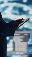 Vertical In a futuristic digital workspace, black developer programming software and explores code snippets. Tech professional embodies innovation, cybersecurity, automation and development. Camera B. video