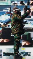Vertical African american soldier working with virtual reality headset in control center, monitoring surveillance footage to gather crucial battlefield and enemy position intelligence. Protection. Camera A. video