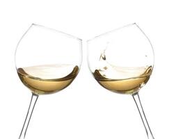 Two wine glasses with white wine in them, cheers photo