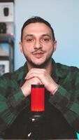Male Podcaster Talking into Professional Microphone While Recording a Podcast in Home Studio Vertical Setup video