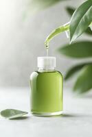 Green Liquid Dropping from Pipette into Bottle. Leaves near Container. Concept of Zero Waste Living on Gray Surface photo