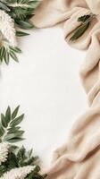 Green Leaves with Beige Fabric on White Background. Minimalist Style. Space for Text. Decorative Border. Zero Waste Living Concept. photo