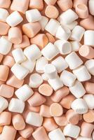 Pile of White and Peach Colored Marshmallows. Sweet Confectionery Treats. Light and Fluffy Gluten Free Desserts. Low Carb Delicious Food Items. photo