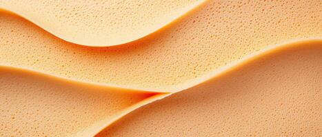 Orange spongy layers forming wavy abstract forms. Conceptual idea for sweet gluten free low carb food or desserts ingredients. photo